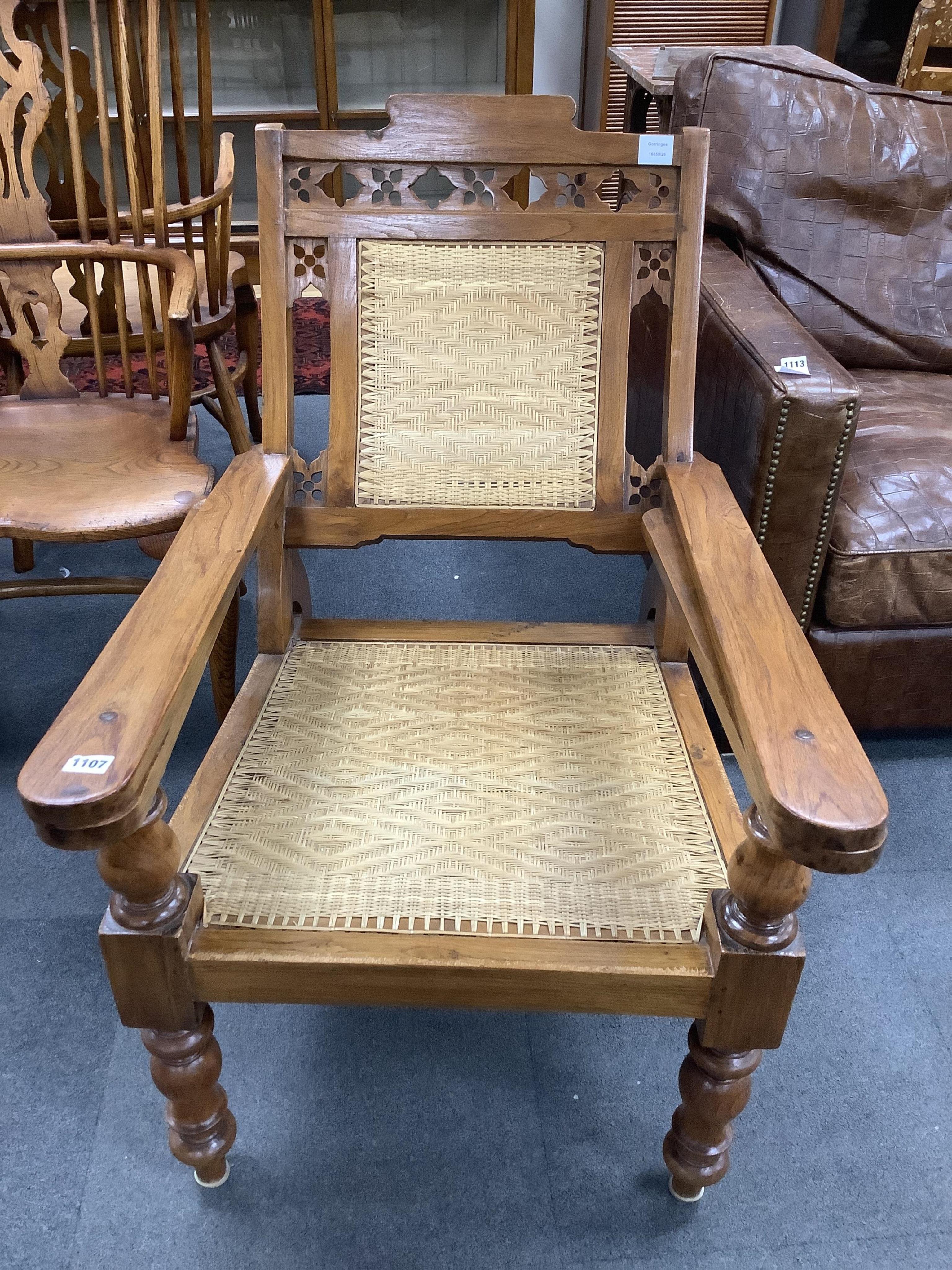 A mid 19th century Anglo Indian teak planter's chair, width 62cm, depth 84cm, height 92cm. Condition - good